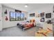 Bright bedroom is complete with sporty décor, a large window, and light walls at 2540 Jay St, Edgewater, CO 80214