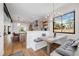 Charming dining area with built-in seating, modern lighting, and views into the kitchen at 2540 Jay St, Edgewater, CO 80214
