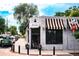 The exterior of Suzette Bakery & Cafe, featuring a striped awning and street view at 2540 Jay St, Edgewater, CO 80214
