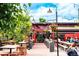 Charming exterior featuring outdoor seating and vibrant floral arrangements at 2540 Jay St, Edgewater, CO 80214