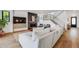 Bright, open living room with hardwood floors, modern fireplace, and staircase to the upper level at 2540 Jay St, Edgewater, CO 80214