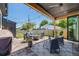 Inviting covered patio with stylish seating area and overhead string lights, perfect for outdoor enjoyment at 2540 Jay St, Edgewater, CO 80214