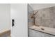 Modern shower with tiled walls, rainfall shower head, and a sleek glass enclosure at 2540 Jay St, Edgewater, CO 80214