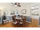 Cozy dining room with hardwood floors, a ceiling fan, and ample natural light at 12223 W 60Th Pl, Arvada, CO 80004