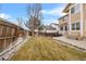 Backyard with grassy area, stone border, and patio at 13735 Steele Ct, Thornton, CO 80602