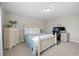 Well-lit bedroom featuring a light-colored bed frame and built-in workspace at 13735 Steele Ct, Thornton, CO 80602