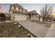 Two-story house with a driveway, attached garage, and landscaping at 13735 Steele Ct, Thornton, CO 80602