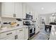 Modern kitchen with stainless steel appliances and white cabinetry at 13735 Steele Ct, Thornton, CO 80602