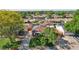An aerial view of a well-maintained home with mature trees, an inviting yard, and solar panels for energy efficiency at 11349 Downing Dr, Northglenn, CO 80233