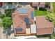 Bird's eye view reveals a home's roof adorned with solar panels, surrounded by a lush landscape at 11349 Downing Dr, Northglenn, CO 80233