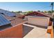 Aerial view of the roof with solar panels, garage, and backyard at 11349 Downing Dr, Northglenn, CO 80233