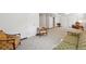 Expansive finished basement featuring plush carpeting and cozy vintage furniture at 11349 Downing Dr, Northglenn, CO 80233