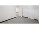 Unfurnished basement featuring carpeted floors, base trim, and a door with passage to other rooms at 11349 Downing Dr, Northglenn, CO 80233