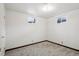 Unfurnished carpeted room in the basement with two windows, offering a blank canvas at 11349 Downing Dr, Northglenn, CO 80233