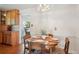 Cozy dining area featuring a round table, chandelier lighting, and classic decor at 11349 Downing Dr, Northglenn, CO 80233