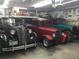 Spacious garage interior featuring three classic cars, ready for car enthusiasts and collectors alike at 11349 Downing Dr, Northglenn, CO 80233