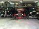 Vintage cars await in this well-lit garage, offering a unique and nostalgic glimpse into automotive history at 11349 Downing Dr, Northglenn, CO 80233