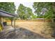 Large, spacious backyard with mature trees providing shade, perfect for outdoor activities at 7010 W 44Th Ave, Wheat Ridge, CO 80033
