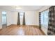 Spacious bedroom with hardwood floors and two windows at 7010 W 44Th Ave, Wheat Ridge, CO 80033