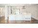Eat in kitchen with white cabinets and a large island at 7010 W 44Th Ave, Wheat Ridge, CO 80033