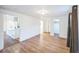 Open living room with hardwood floors, and view to kitchen and bedrooms, creating a spacious layout at 7010 W 44Th Ave, Wheat Ridge, CO 80033