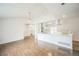 Bright, open living room flows into the kitchen with stainless steel appliances at 7010 W 44Th Ave, Wheat Ridge, CO 80033