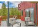 Large outdoor deck with comfortable seating and chairs, perfect for relaxing and enjoying the mountain views at 387 Pine Dr, Idaho Springs, CO 80452
