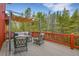 Outdoor deck features comfortable seating and a pergola, perfect for relaxing and enjoying the beautiful views at 387 Pine Dr, Idaho Springs, CO 80452