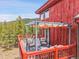 Comfortable seating on a deck with a pergola with mountain views at 387 Pine Dr, Idaho Springs, CO 80452