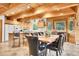 Dining room with wood paneled walls and matching wood table at 387 Pine Dr, Idaho Springs, CO 80452