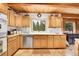 Well-lit kitchen features wood cabinets and stainless steel appliances at 387 Pine Dr, Idaho Springs, CO 80452