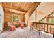 Lofted sitting room with warm wood accents and views of the outdoors at 387 Pine Dr, Idaho Springs, CO 80452