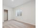 Bedroom featuring neutral walls and carpet with natural light and closet at 660 Split Rock Dr, Erie, CO 80516