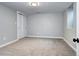 Spacious bedroom featuring neutral paint and carpet with a large closet at 3033 Leyden St, Denver, CO 80207