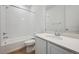 Bathroom featuring a shower and tub combination, sleek vanity, and modern fixtures at 9061 Telluride Ct, Commerce City, CO 80022