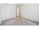 This carpeted bedroom offers closet storage and natural light at 9061 Telluride Ct, Commerce City, CO 80022
