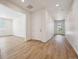 Inviting entryway with modern wood flooring and an abundance of natural light at 9061 Telluride Ct, Commerce City, CO 80022