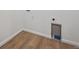 Laundry hook-up area with wood flooring at 9061 Telluride Ct, Commerce City, CO 80022