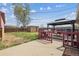 Spacious backyard featuring a deck with pergola and a storage shed at 6860 Krameria St, Commerce City, CO 80022