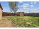 Backyard featuring a storage shed and wood fence at 6860 Krameria St, Commerce City, CO 80022