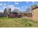 Backyard with deck, pergola and storage shed at 6860 Krameria St, Commerce City, CO 80022