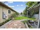 Backyard featuring a stone path, green lawn, and an outdoor seating area at 1235 S Balsam St, Lakewood, CO 80232