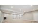 Open basement with a fireplace, great for gatherings and cozy evenings at 1235 S Balsam St, Lakewood, CO 80232