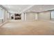 Expansive finished basement with neutral carpeting, ideal for entertaining and relaxing at 1235 S Balsam St, Lakewood, CO 80232