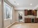 Finished basement area features a bar with sleek countertops and wine storage at 1235 S Balsam St, Lakewood, CO 80232