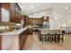 Well-appointed kitchen featuring granite countertops, stainless steel appliances, and an island with barstool seating at 1235 S Balsam St, Lakewood, CO 80232