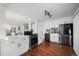 Modern kitchen with white cabinets, stainless steel appliances, and an open layout at 2996 S Sheridan Blvd, Denver, CO 80227