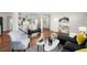 Spacious living area with hardwood floors, modern furnishings, and a bright, open design at 2996 S Sheridan Blvd, Denver, CO 80227