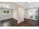 Bright dining room boasts hardwood floors, neutral paint, and sliding glass door to backyard at 1001 Victor St, Aurora, CO 80011