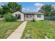Charming front yard, and a well-maintained lawn at 1001 Victor St, Aurora, CO 80011